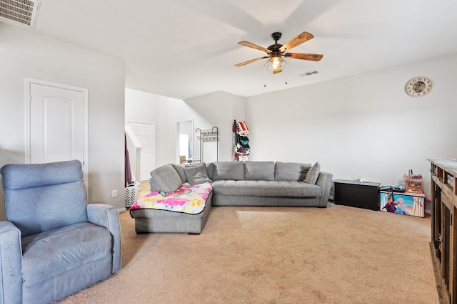 carpeted living room with ceiling fan