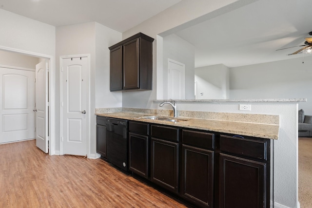 kitchen with dishwasher, sink, ceiling fan, dark brown cabinets, and light hardwood / wood-style flooring