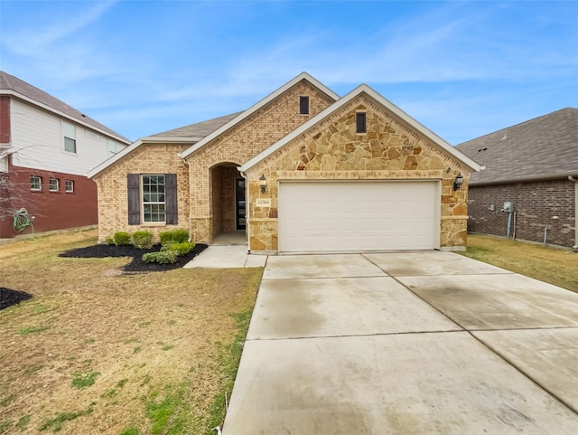 view of front of house with a garage and a front lawn