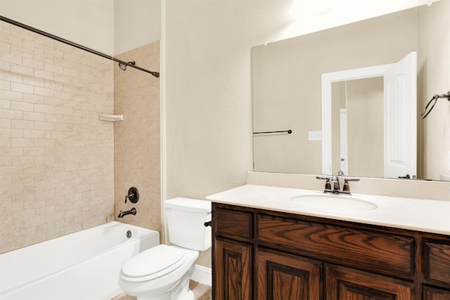 bathroom featuring shower / bathtub combination, vanity, and toilet