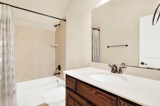 full bath featuring vanity, shower / bath combo with shower curtain, and toilet