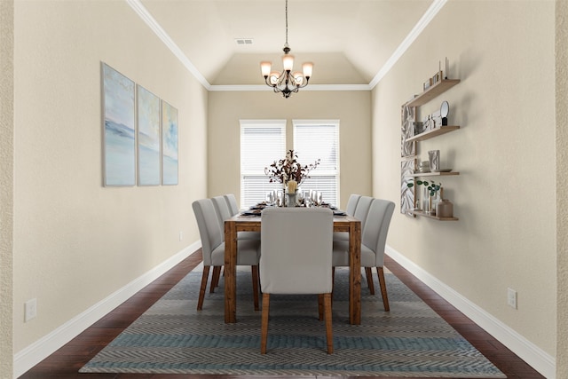 dining room with dark wood finished floors, visible vents, ornamental molding, a chandelier, and baseboards