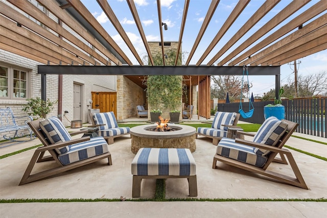 view of patio / terrace featuring a pergola and a fire pit