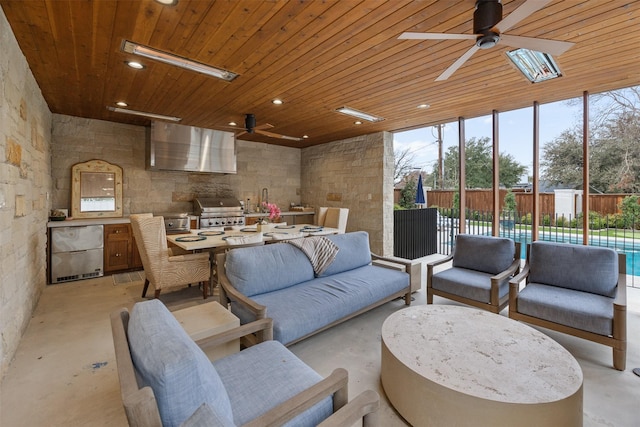 living room with sink, wood ceiling, plenty of natural light, and floor to ceiling windows