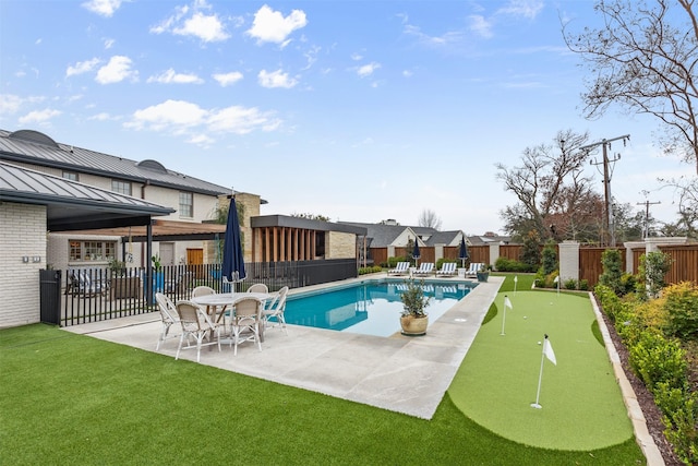 view of swimming pool with a patio