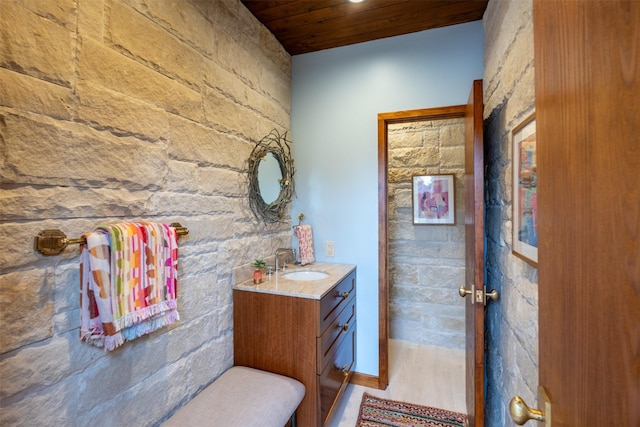 bathroom with vanity and wooden ceiling