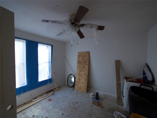 interior space featuring ceiling fan and a healthy amount of sunlight