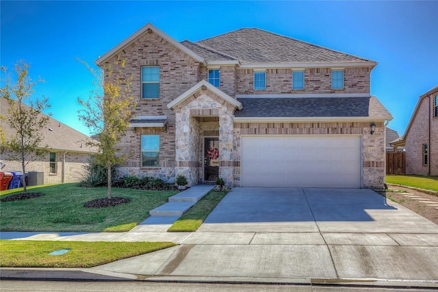 view of front of house with a garage and a front yard