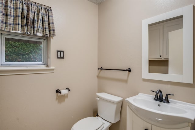 bathroom with toilet and sink