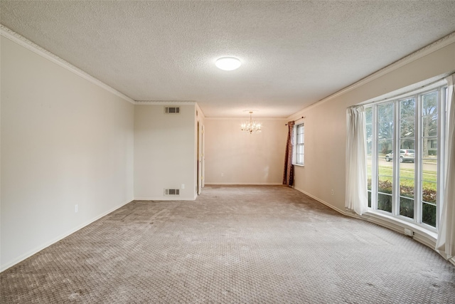 unfurnished room featuring ornamental molding, carpet, a notable chandelier, and a textured ceiling