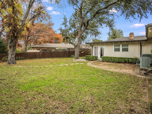 view of yard with central AC