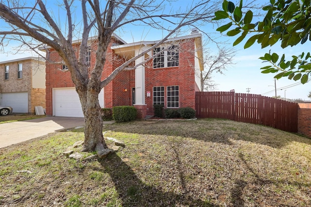 view of front of home with a garage and a front lawn