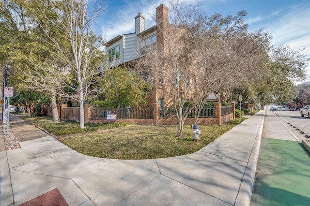 view of community featuring a lawn