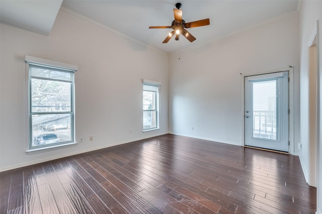 unfurnished room with ornamental molding, ceiling fan, and dark hardwood / wood-style flooring