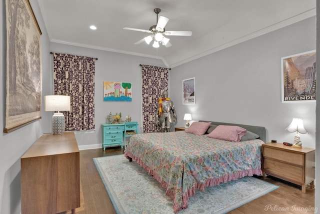 bedroom with crown molding, wood-type flooring, and ceiling fan