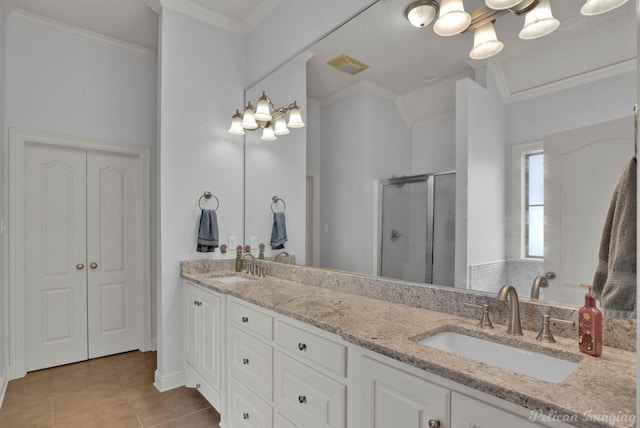 bathroom with crown molding, vanity, tile patterned floors, and a shower with shower door