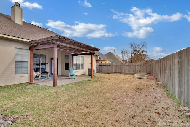 view of yard with a patio, a pergola, and central air condition unit