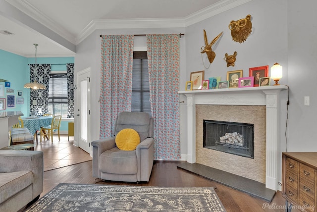 living room with ornamental molding and dark hardwood / wood-style floors