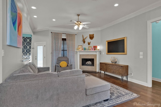 living room with crown molding, ceiling fan, and dark hardwood / wood-style flooring