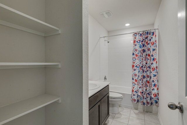 bathroom with vanity, visible vents, shower / bath combo with shower curtain, tile patterned floors, and toilet