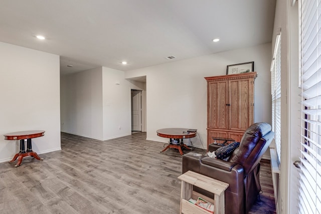 sitting room with recessed lighting, light wood-style flooring, and baseboards