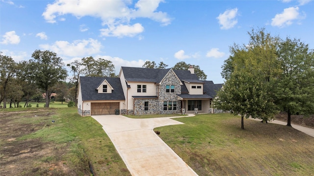 view of front of property featuring a garage and a front lawn