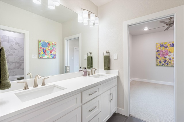 bathroom featuring ceiling fan and vanity