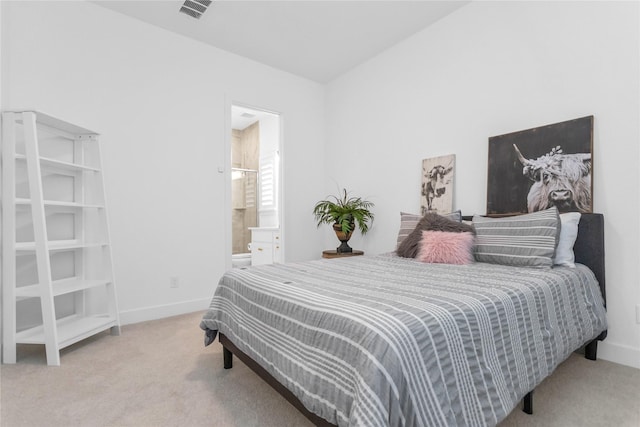 carpeted bedroom featuring ensuite bathroom