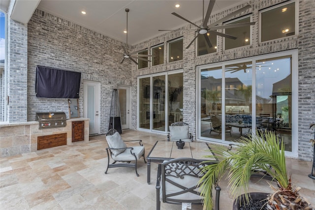 view of patio / terrace with ceiling fan and area for grilling