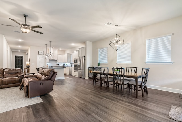 living room with ceiling fan, dark hardwood / wood-style flooring, and sink