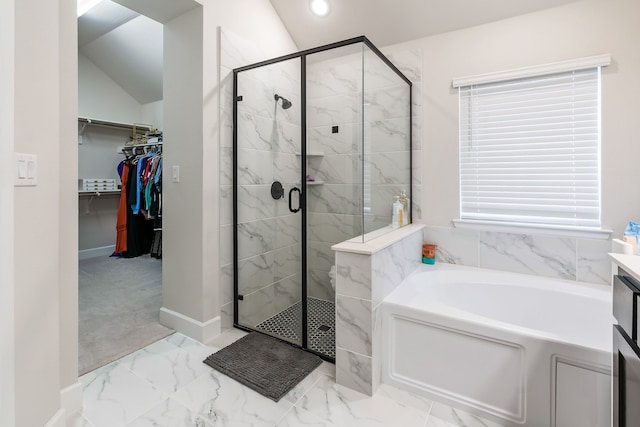 bathroom with vanity and shower with separate bathtub