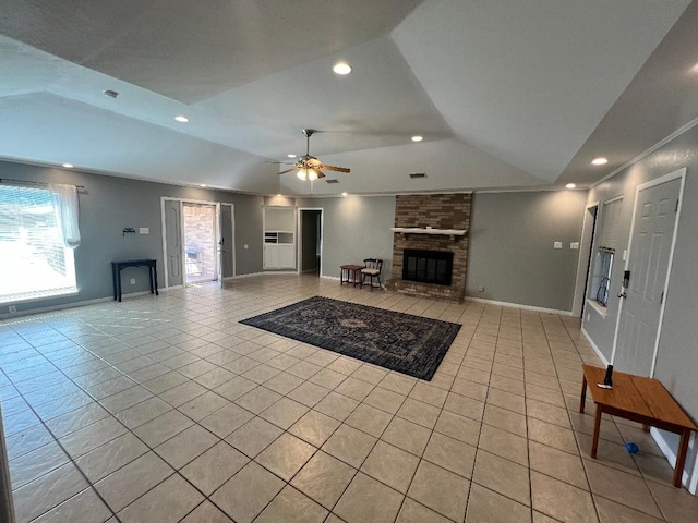 living room featuring light tile patterned flooring, a brick fireplace, and lofted ceiling