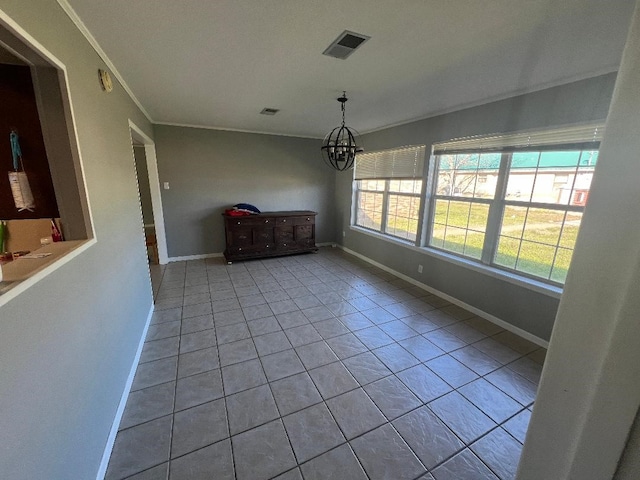 unfurnished dining area featuring crown molding, light tile patterned floors, and a chandelier