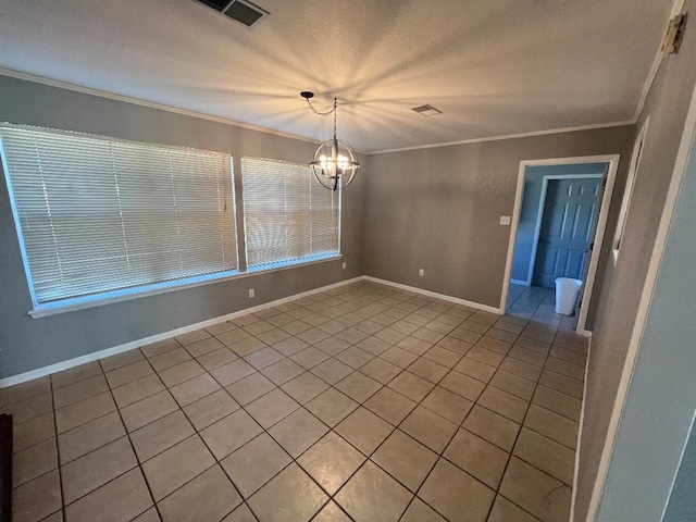 tiled empty room with a notable chandelier and crown molding