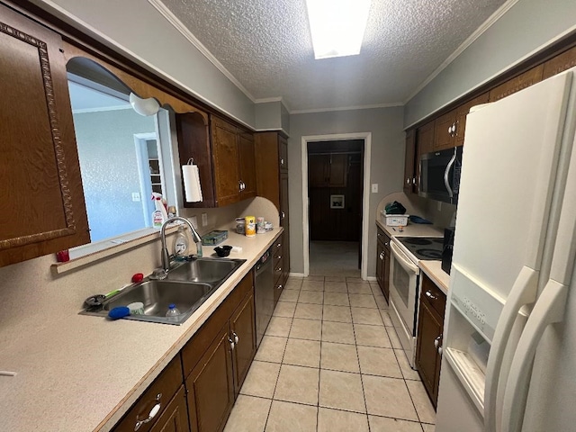 kitchen with light tile patterned flooring, sink, a textured ceiling, ornamental molding, and white appliances