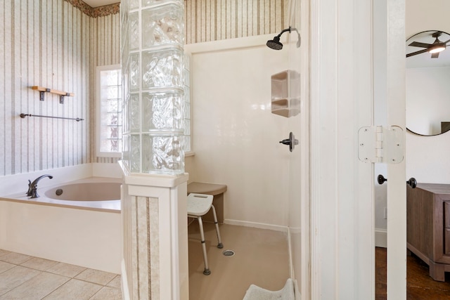 bathroom featuring a washtub and tile patterned floors