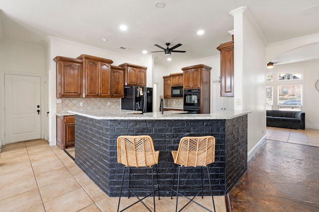 kitchen featuring tasteful backsplash, ornamental molding, kitchen peninsula, ceiling fan, and black appliances