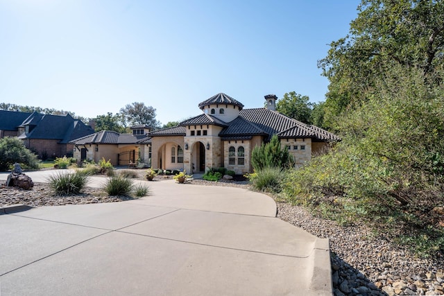 mediterranean / spanish house with a garage