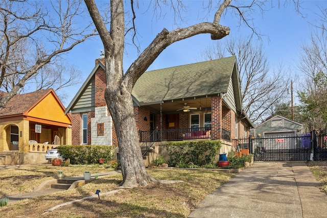 view of front of house with a garage, ceiling fan, and a porch