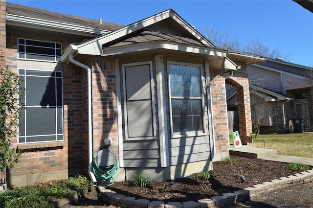 exterior space featuring brick siding