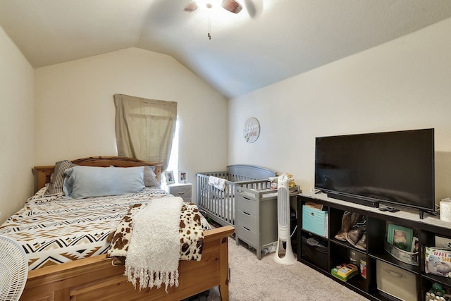 carpeted bedroom featuring lofted ceiling