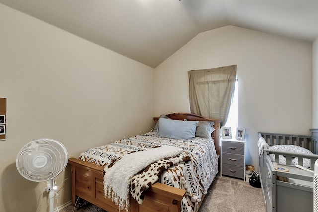 carpeted bedroom featuring lofted ceiling