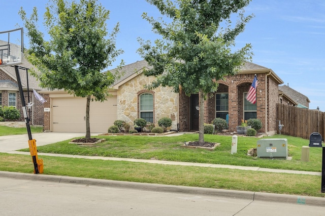 view of front of property featuring a garage and a front lawn