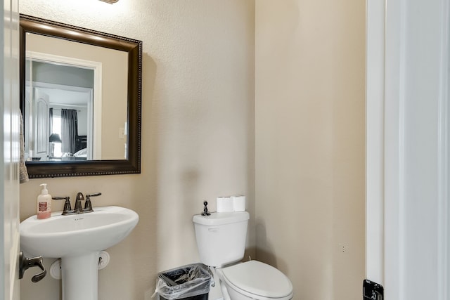 bathroom featuring sink and toilet