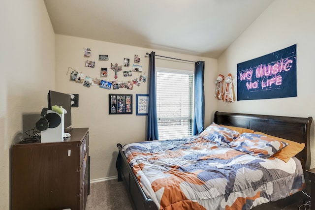 carpeted bedroom featuring vaulted ceiling