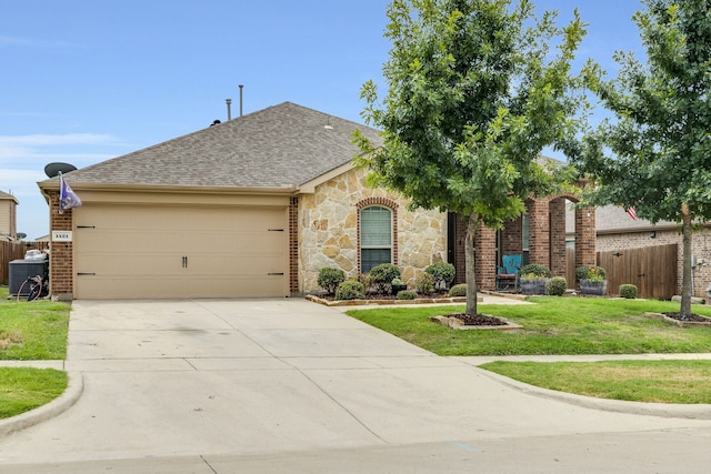 ranch-style home with a garage, central air condition unit, and a front lawn