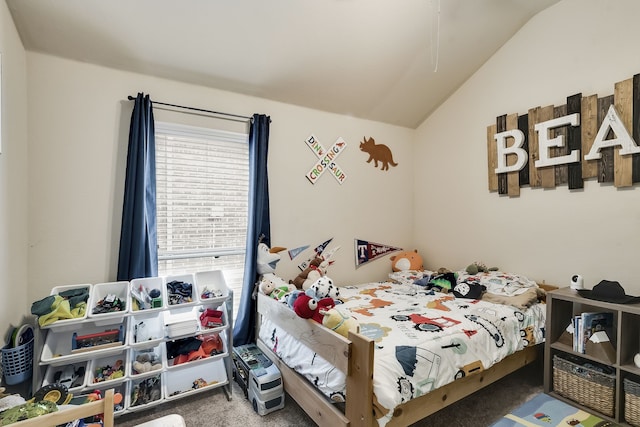 bedroom with carpet floors and vaulted ceiling