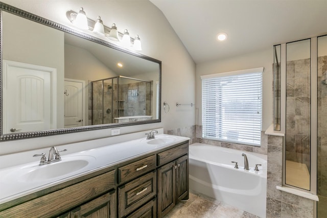 bathroom with vaulted ceiling, plus walk in shower, and vanity