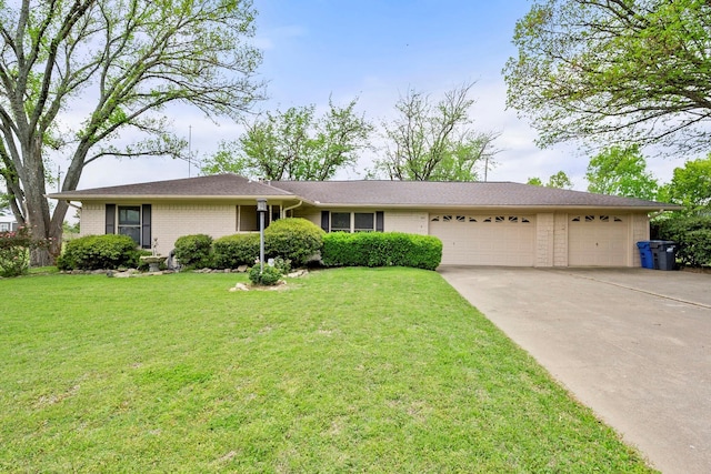 single story home with a garage and a front yard