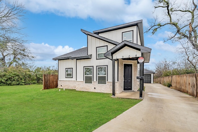 modern farmhouse style home with a garage and a front lawn